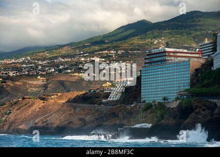 Hotel Semiramis and waves in front of the beach in Puerto de la Cruz, Tenerife Island, Canary Islands, Spain Stock Photo