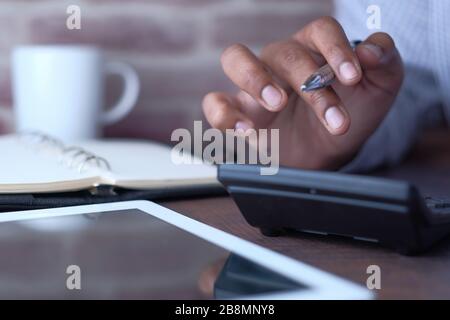 young man doing his accounting, financial adviser working Stock Photo