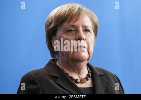 Berlin, Germany. German Chancellor Angela Merkel has put herself in quarantine after a doctor she met Friday tested positive for coronavirus. 22nd Mar, 2020. File photo taken on Feb 19, 2020 shows German Chancellor Angela Merkel attending a press conference in Berlin, capital of Germany. German Chancellor Angela Merkel has put herself in quarantine after a doctor she met Friday tested positive for coronavirus, government spokesman Steffen Seibert said on March 22, 2020. Credit: Shan Yuqi/Xinhua/Alamy Live News Stock Photo