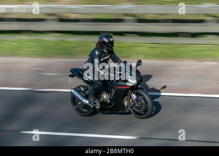 Honda CBR Fireblade driving on the M6 motorway near Preston in Lancashire, UK Stock Photo