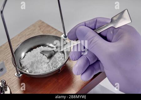 Pharmacist or scientist preparing medicine using precision weighing Stock Photo