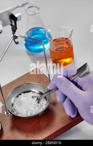 Pharmacist or scientist preparing medicine using precision weighing Stock Photo