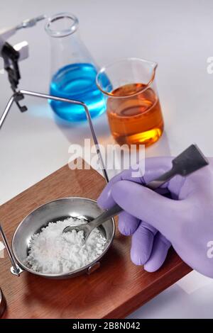 Pharmacist or scientist preparing medicine using precision weighing Stock Photo