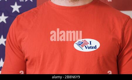 Man putting on I Voted Today button for Presidential election 2020 in America. Stock Photo