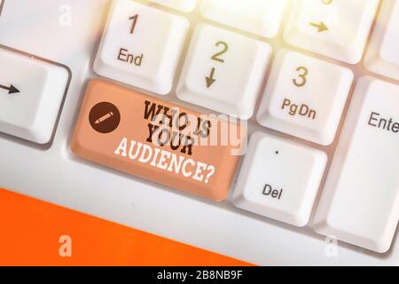 Conceptual hand writing showing Who Is Your Audience Question. Concept meaning who is watching or listening to it Stock Photo