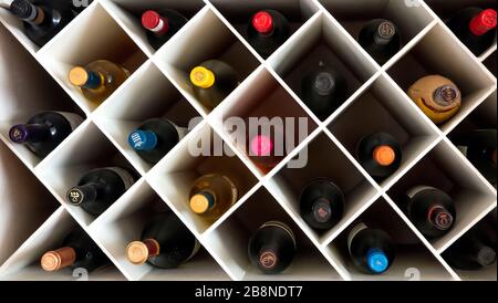 White wine rack with bottles Stock Photo