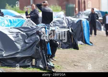 Asylum seekers at the French port of Calais. Everyday hundreds of asylum seekers attempt to stow away inside trucks to allow them to travel illegally Stock Photo