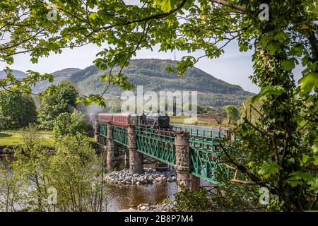 BR '5MT' 4-6-0 No. 45212 crosses the River Lochy with the 10.15 Jacobite from Fort William to Mallaig - May 14th 2019 Stock Photo