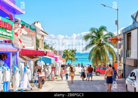 PLAYA DEL CARMEN, MEXICO - DEC. 26, 2019: Visitors enjoy shopping on the famous entertainment district of Playa del Carmen beach in the Yucatan penins
