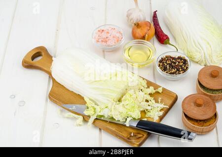 Sliced peking cabbage, spices for cooking vegetable diet dishes. Studio Photo Stock Photo