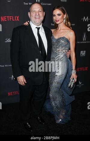 (FILE) Harvey Weinstein Tests Positive for Coronavirus COVID-19. Harvey Weinstein Tests Positive For Coronavirus In New York State Prison. Convicted Producer In Isolation. BEVERLY HILLS, LOS ANGELES, CALIFORNIA, USA - JANUARY 08: American film producer Harvey Weinstein and wife/fashion designer Georgina Chapman arrive at The Weinstein Company and Netflix Golden Globe Party, presented with FIJI Water, Grey Goose Vodka, Lindt Chocolate, and Moroccan Oil held at The Beverly Hilton Hotel on January 8, 2017 in Beverly Hills, Los Angeles, California, United States. (Photo by Xavier Collin/Image Pres Stock Photo