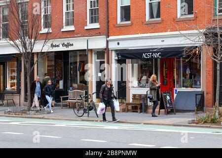 People walking along Eighth Ave in the West Village of Manhattan, New York, NY. March 14, 2020. Stock Photo