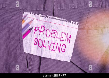 Writing note showing Problem Solving. Business concept for process of finding solutions to difficult or complex issues Writing equipment and white not Stock Photo