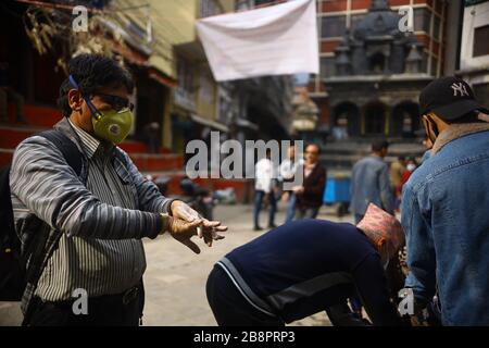 Kathmandu, Nepal. 22nd Mar, 2020. A man washing his hands with soap at a public hand wash station as precaution against coronavirus (COVID-19) outbreak at Asan in Kathmandu, Nepal. (Photo by Subash Shrestha/Pacific Press) Credit: Pacific Press Agency/Alamy Live News Stock Photo