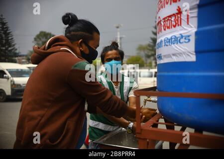 Kathmandu, Nepal. 22nd Mar, 2020. Men washing their hands with soap at a Public hand wash station as a precaution against Corona virus (COVID-19) outbreak at Ratnapark in Kathmandu, Nepal (Photo by Subash Shrestha/Pacific Press) Credit: Pacific Press Agency/Alamy Live News Stock Photo