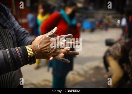 Kathmandu, Nepal. 22nd Mar, 2020. A man washes his hand with soap at a public hand wash station as a precaution against Corona virus (COVID-19) outbreak at Asan in Kathmandu, Nepal. (Photo by Subash Shrestha/Pacific Press) Credit: Pacific Press Agency/Alamy Live News Stock Photo