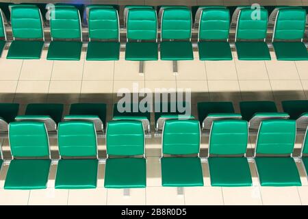 Green empty seats at an airport waiting area. High angle view. Stock Photo