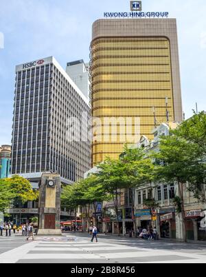 Art deco clock tower in Medan Pasar Old Market Square Kwong Hing Group office tower and HSBC building Chinatown Kuala Lumpur Malaysia. Stock Photo