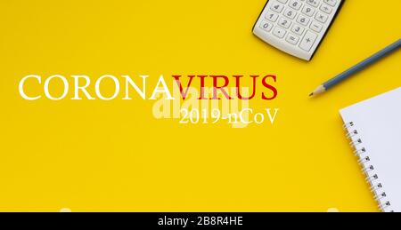 Epidemic concept, coronavirus as a pandemic. Calculator, notepad and pencil on a yellow background, space for text Stock Photo