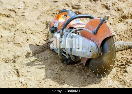 Sawing machine for cutting marble stone at reconstruction area. Closeup Stock Photo