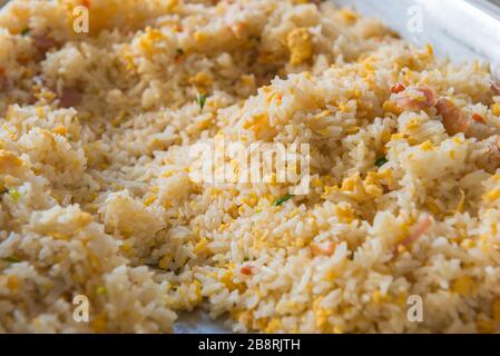Pork fried rice on wood table in the morning. Stock Photo