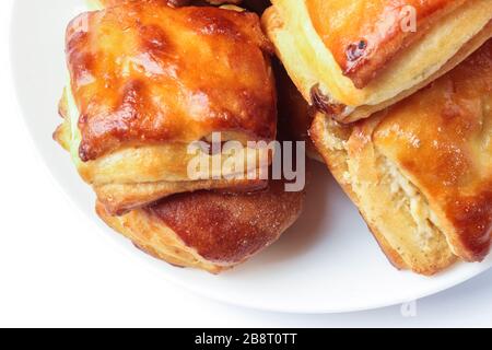 Buns with cottage cheese and raisins isolated on white Stock Photo