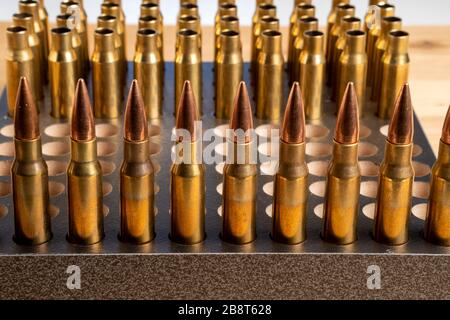 Production of cartridges for a rifle, reload. Empty shells and ammunition Stock Photo