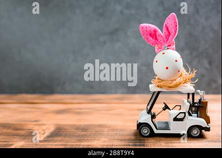 Happy Easter. Colorful painting egg on golf car for celebrate in April. Preparing and painting for family home decoration. Stock Photo