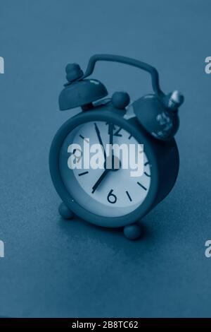 selective focus, small blue alarm clock with numbers Stock Photo
