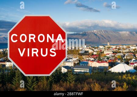 Reykjavik, Iceland - March 20th 2020: Concept image with large red Coronavirus warning sign in front of city skyline, travel restriction concept Stock Photo