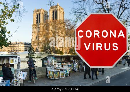 Paris, France - March 20th 2020: Concept image with large red Coronavirus warning sign in front of Notre Dame cathedral, travel restriction concept Stock Photo