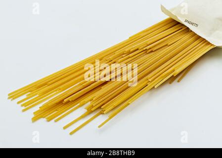 Pasta package with italian raw Spaghetti. Fresh italian pasta isolated on white Stock Photo