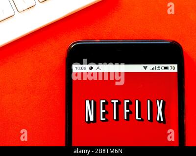 In this photo illustration Netflix logo is seen displayed on a smartphone Stock Photo