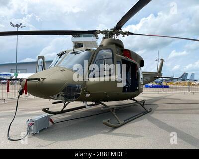 Singapore - Feb 12, 2020. Subaru Bell 412EPX helicopter standing for display in Changi Air Base. Defense costs are increasing, especially in East Asia Stock Photo