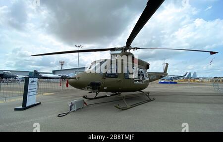 Singapore - Feb 12, 2020. Subaru Bell 412EPX helicopter standing for display in Changi Air Base. Defense costs are increasing, especially in East Asia Stock Photo