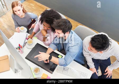 Web designer and graphic designer team on the computer in the office of the internet agency Stock Photo
