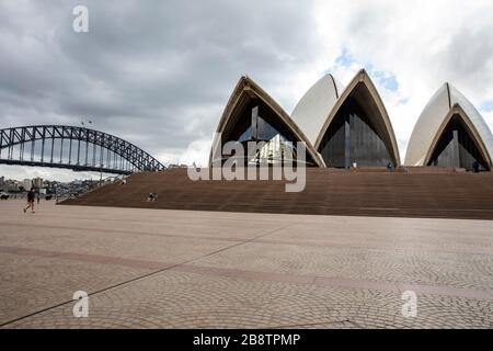 Sydney city centre, Australia. Monday 23rd March 2020. Lunch time at the Sydney Opera House with barely a visitor. Credit Martin Berry/Alamy Live News