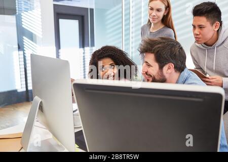 Computer science students or young programmers on computers in an IT training course Stock Photo