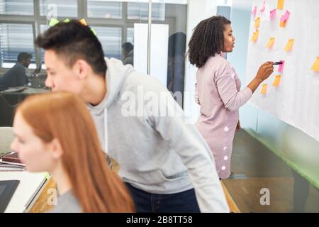 Web designers and developers work together in the internet agency's office Stock Photo
