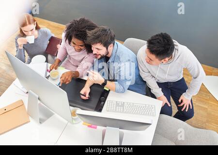 Creative team in an internet agency or web agency works on the computer Stock Photo