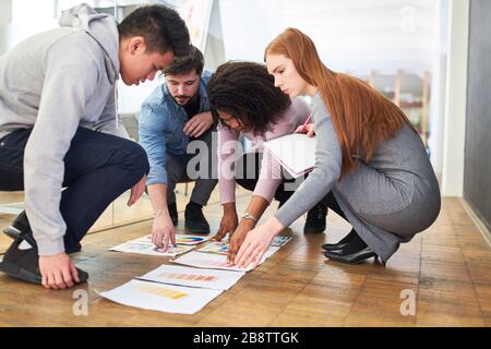 Graphic designers and web designers work together on the color selection for a project Stock Photo