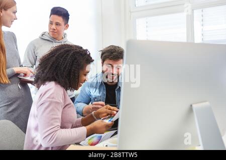 Creative web design start-up team develops a new graphic design on the computer Stock Photo