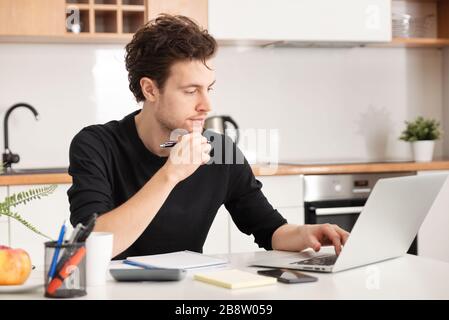 Young man working at home. Home office, remotely working concept Stock Photo