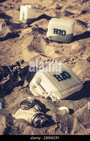Unclean water cans filled with toxins and sand Stock Photo