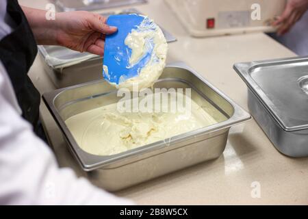 Making chocolate. . Chocolate factory. Liquid chocolate in a pan. Stock Photo