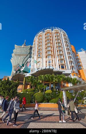 People passing by the Hotel Lisboa. Macau, China. Stock Photo