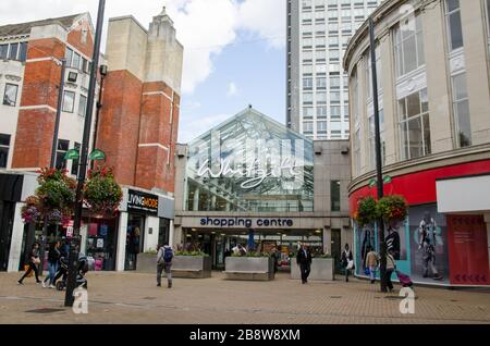 Croydon, UK - October 2, 2019: Shoppers at the entrance to the landmark Whitgift Shopping Centre in Croydon, South London on a sunny autumn afternoon. Stock Photo