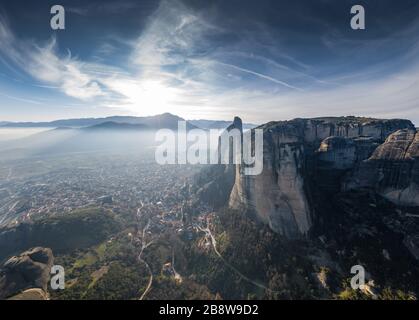 Aerial view of Unesco monument Meteora, the mountains, the landmark of Greek, sunny weather, fog, haze over a valley Stock Photo