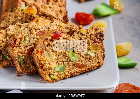 Bread with dried fruits on a gray plate. Stock Photo