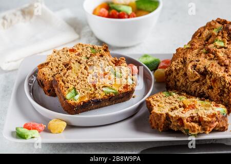 Bread with dried fruits on a gray plate. Stock Photo